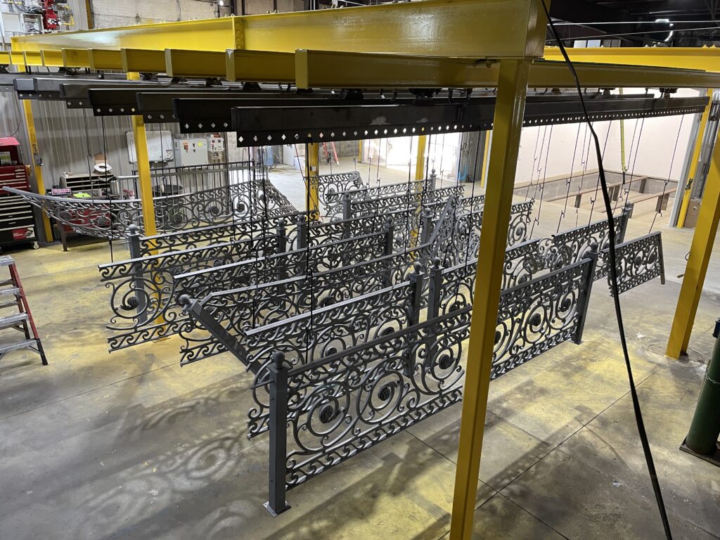 intricate designed iron work with black powder coating